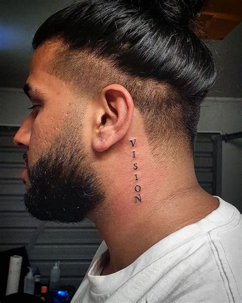 guy with neck tattoo